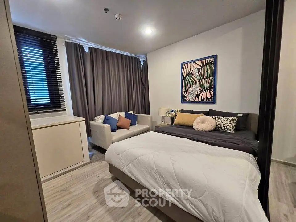 Cozy modern bedroom with stylish decor and natural light