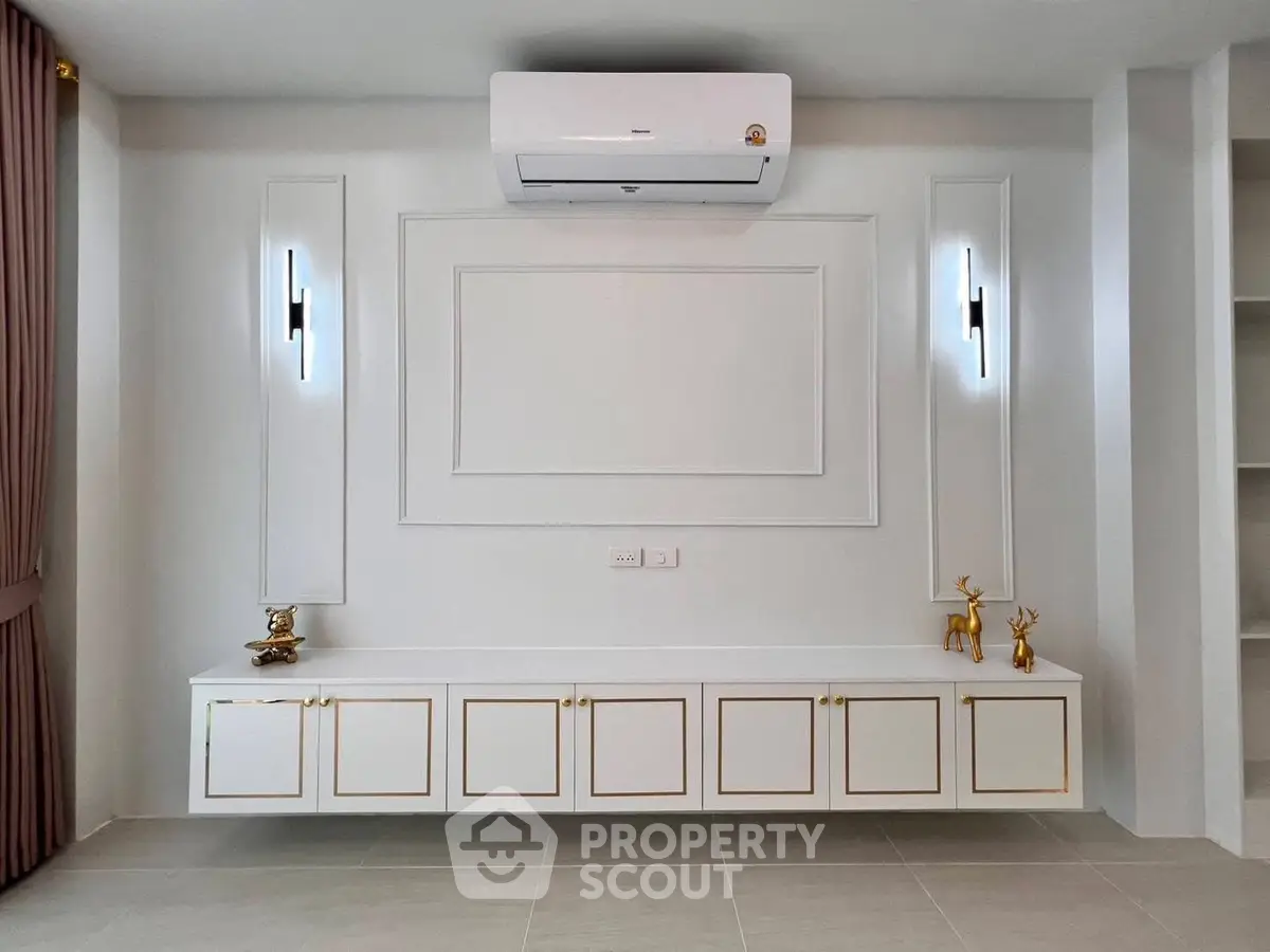 Elegant modern living room with built-in storage and air conditioning