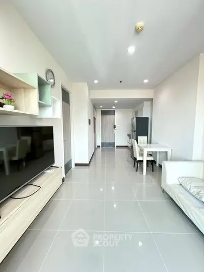 Modern living room with sleek furniture and open layout, perfect for contemporary living.