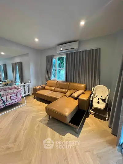 Spacious living room with modern leather sofa and chic decor