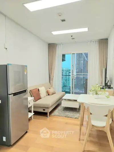 Modern living room with city view, stylish furniture, and natural light.