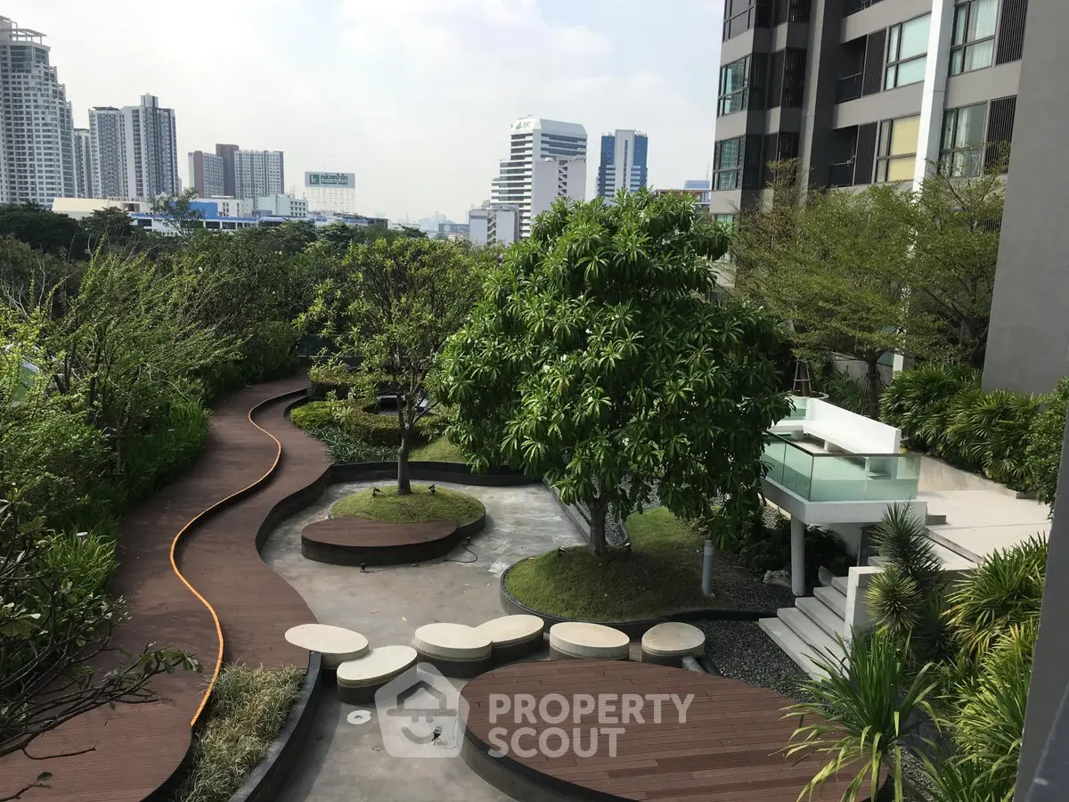 Luxurious urban garden with modern landscaping and city skyline views, perfect for relaxation and outdoor activities.