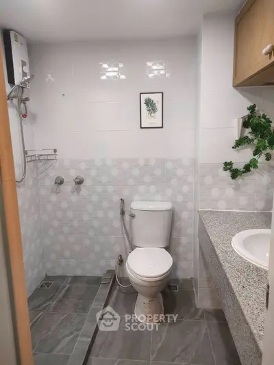Modern bathroom with sleek design and elegant fixtures in a contemporary home.