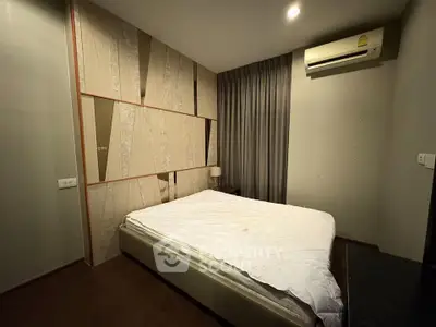 Cozy bedroom with modern decor and air conditioning unit