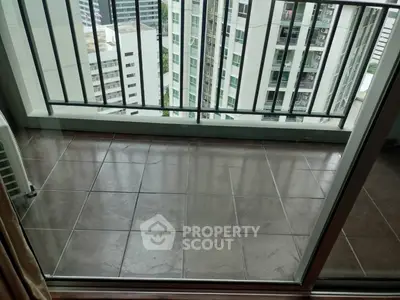 Modern high-rise balcony with city view, perfect for urban living enthusiasts.