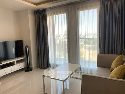 Modern living room with large windows and stylish furniture