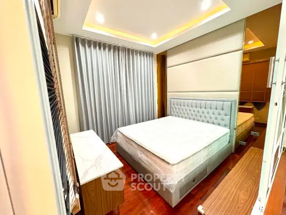 Modern bedroom with elegant design and ambient lighting