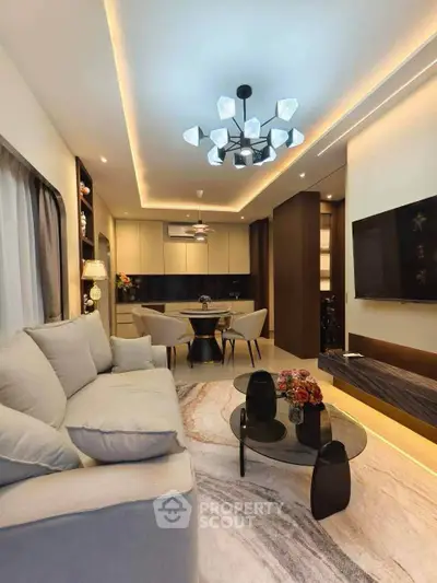 Modern living room with elegant lighting and stylish furniture in a cozy apartment.