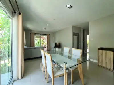 Spacious open-plan living and dining area with garden view