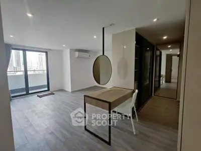 Spacious modern living room with city view and stylish decor