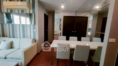 Modern living room with stylish dining area and air conditioning in a contemporary apartment.