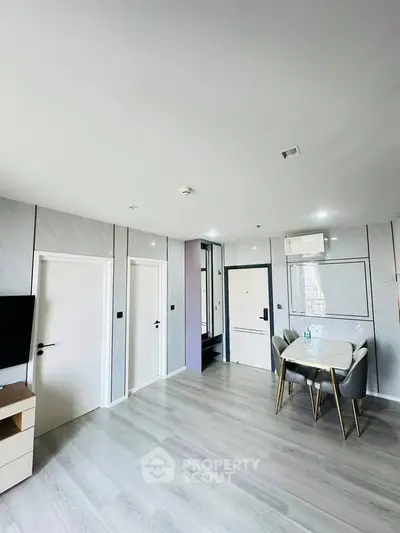 Modern living room with sleek dining area and minimalist design