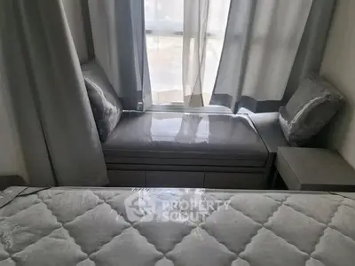 Cozy bedroom with elegant gray decor and window seating