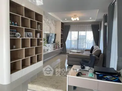 Modern living room with stylish shelving and cozy seating area