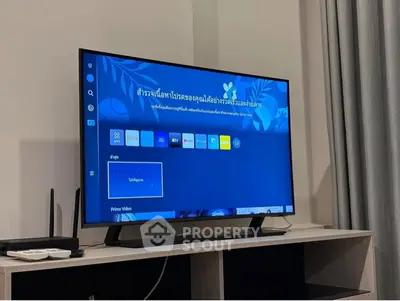 Modern living room with smart TV and sleek entertainment unit