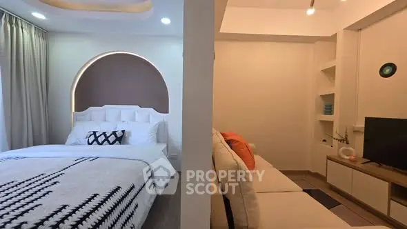 Modern studio apartment with stylish bedroom and cozy living area