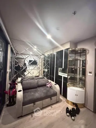 Stylish living room with modern decor and mirrored wall accents