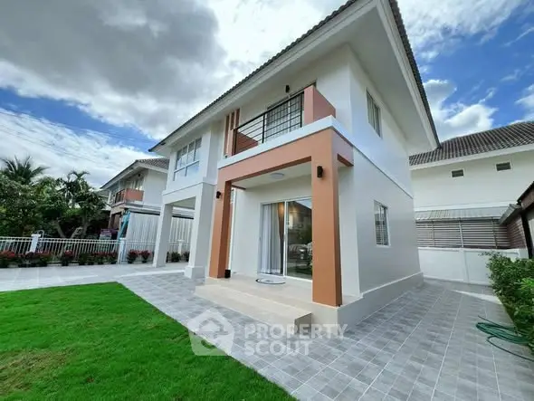 Modern two-story house with spacious lawn and elegant exterior design