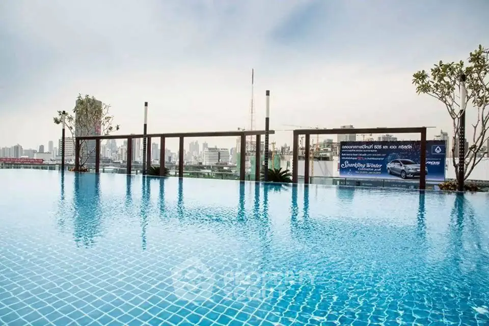 Luxurious rooftop infinity pool with stunning city skyline view