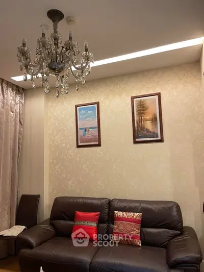 Elegant living room with chandelier and stylish decor