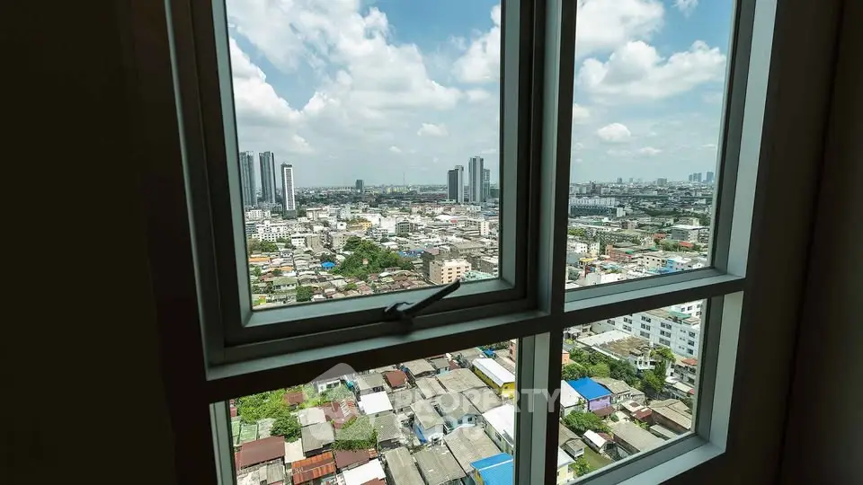Stunning cityscape view from high-rise window, showcasing urban skyline and vibrant neighborhood.
