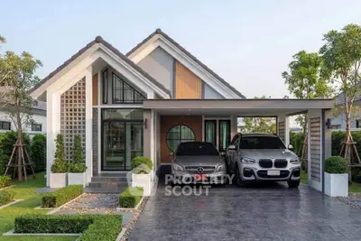 Modern suburban house with two-car garage and landscaped garden