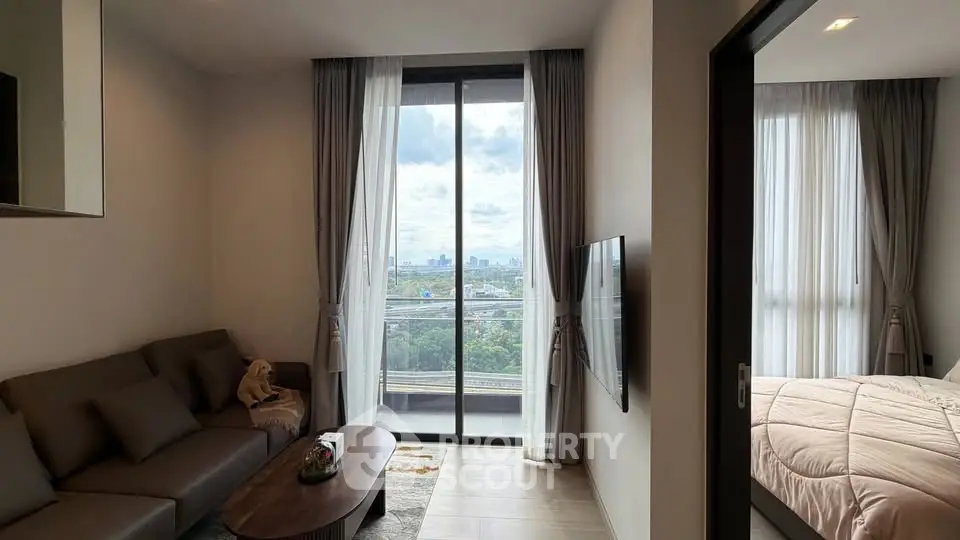 Modern living room with city view and cozy bedroom in luxury apartment