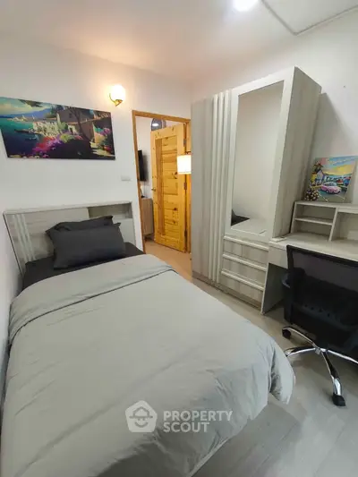Cozy bedroom with modern furniture and stylish decor, perfect for a comfortable living experience.
