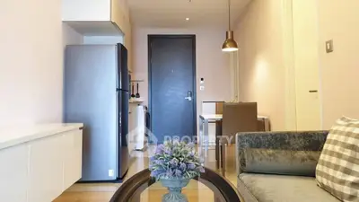 Modern apartment interior with cozy living area and sleek kitchen design.