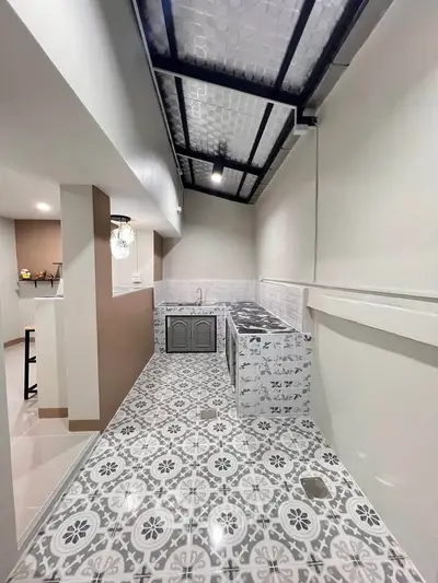 Stylish kitchen with patterned tiles and modern design, perfect for culinary enthusiasts.