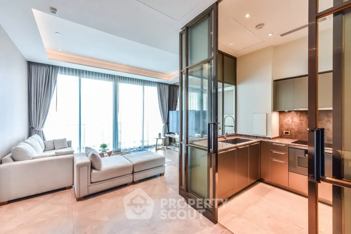 Luxurious open-layout living room with modern kitchen and floor-to-ceiling windows.