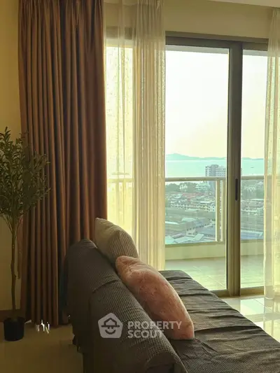 Stylish living room with cozy sofa and stunning balcony view