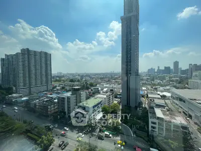 Stunning cityscape view from high-rise building showcasing urban skyline and bustling streets.