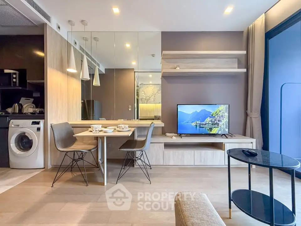 Modern living room with stylish decor and integrated kitchen appliances