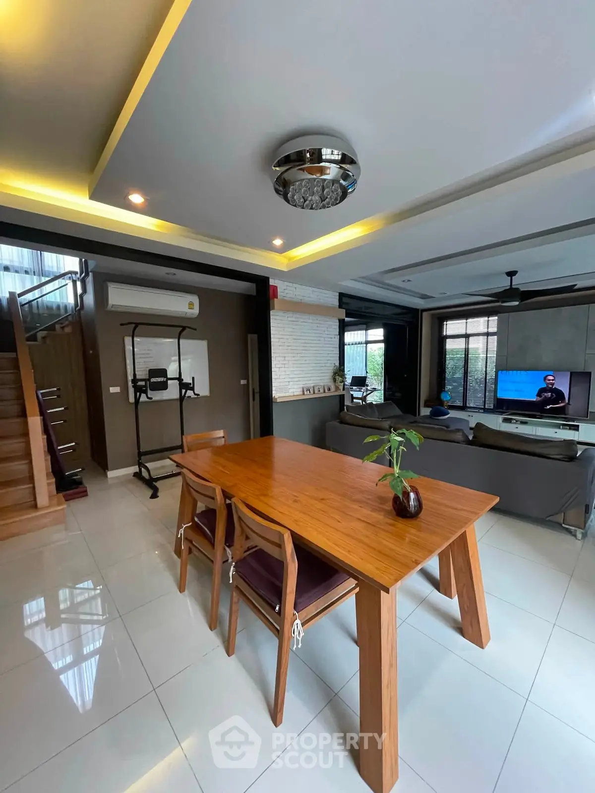 Spacious modern living room with elegant dining area and stylish decor
