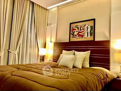 Luxurious bedroom with elegant decor and modern art, featuring plush bedding and ambient lighting.