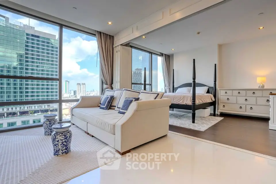 Luxurious corner unit with stunning city views, spacious living area, and elegant bedroom in a high-rise building.