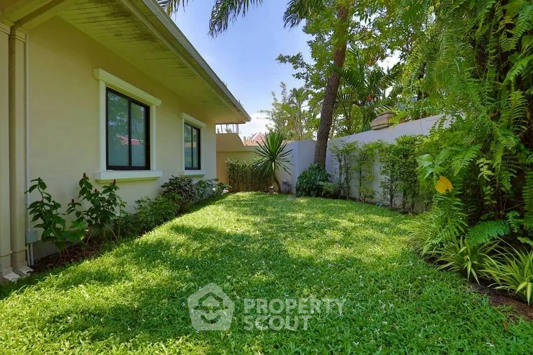 Charming garden view with lush greenery and cozy outdoor space