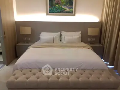 Luxurious bedroom with elegant decor and plush bedding in modern real estate property.