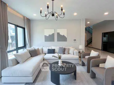 Spacious modern living room with elegant decor and large windows