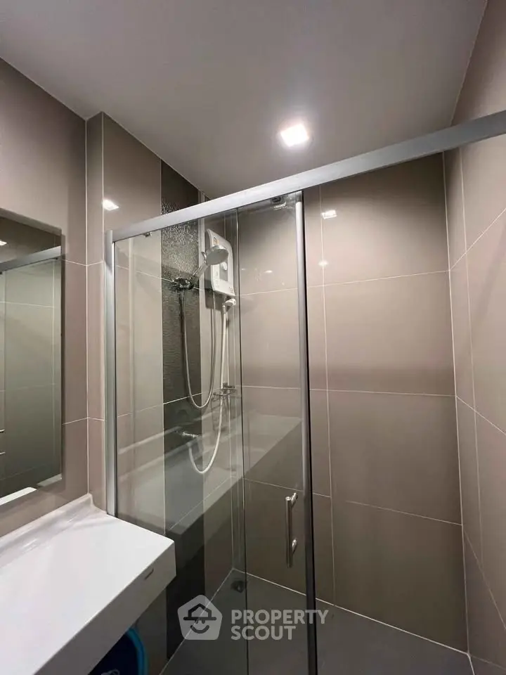 Modern bathroom with sleek shower enclosure and contemporary fixtures