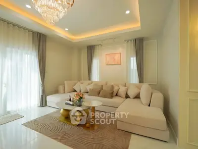 Luxurious living room with elegant chandelier and plush sectional sofa
