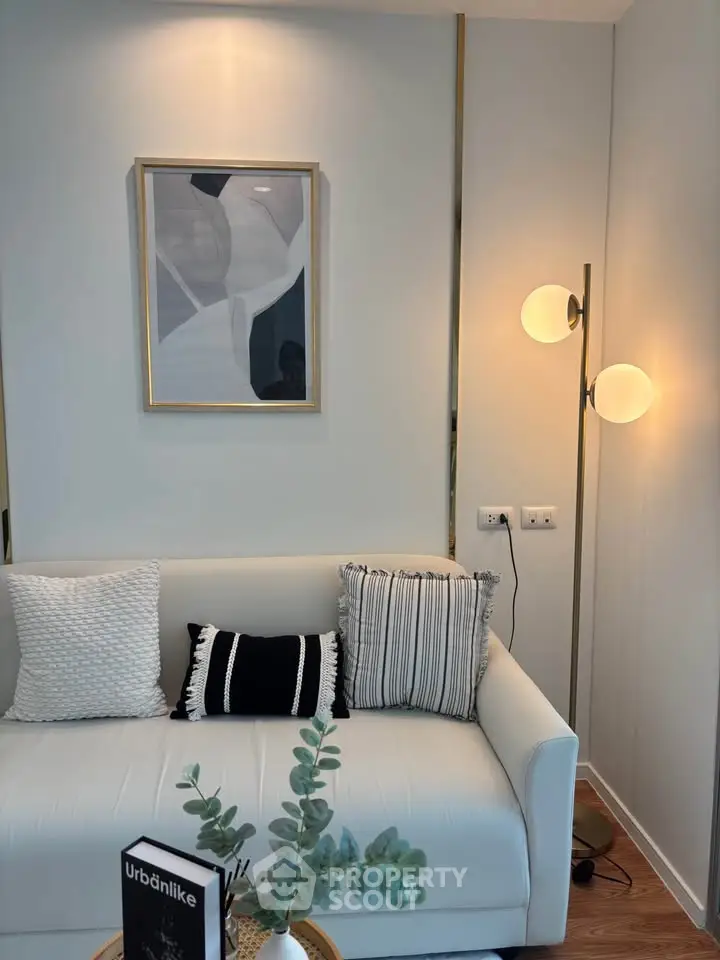 Stylish modern living room with elegant decor and cozy white sofa, perfect for relaxation and comfort.