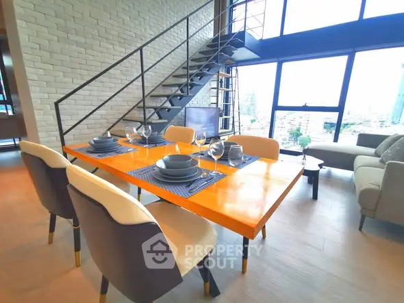 Modern loft apartment with stylish dining area and city view