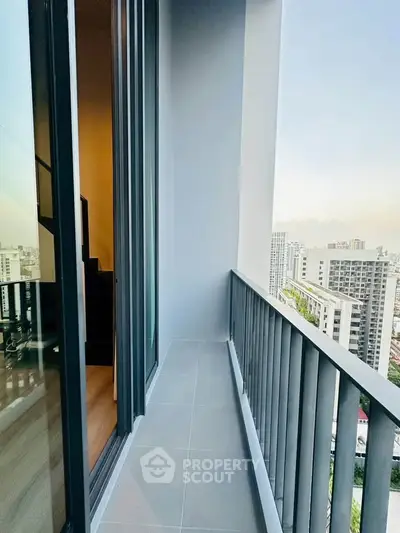 Modern high-rise balcony with stunning cityscape views and sleek railing design.
