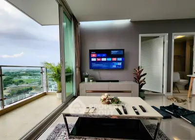 Modern living room with balcony view and wall-mounted TV