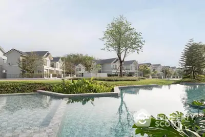 Luxurious residential community with serene pool and lush greenery