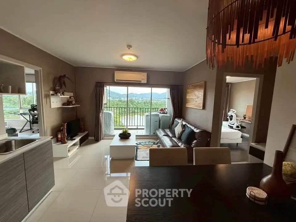 Modern living room with open layout and scenic balcony view