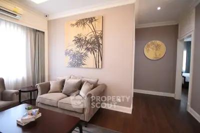 Elegant living room with plush sofa and stylish decor in modern apartment