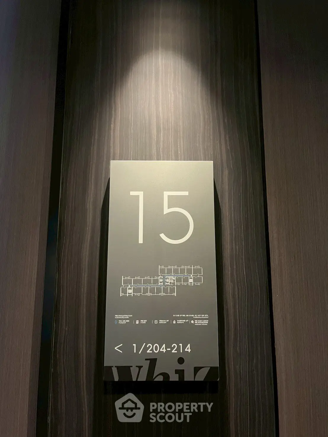 Modern building floor number sign with sleek design and floor plan details.